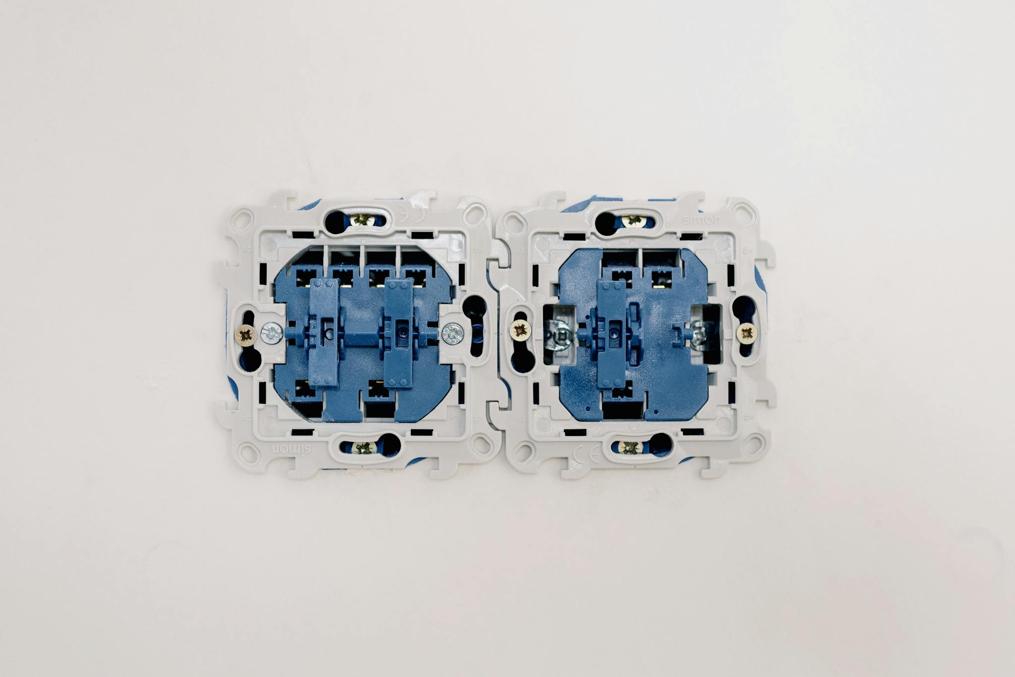 Detailed view of electrical sockets in a wall, ideal for renovation themes.